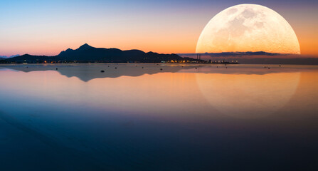 Poster - Fantastic landscape with a giant moon against the backdrop of a seascape