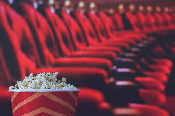 pop corn and on red armchair cinema