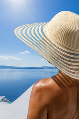 Wall Mural - Woman on holidays in Santorini island