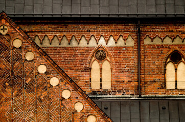 Gothic style decorated orange brick wall of Riga Doms cathedral in old town of Riga (Vecriga), Latvia.