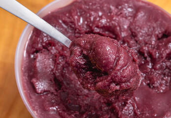 Spoon with Frozen açai ( açaí, acai ) in close-up.  Brazilian food, Food, Brazil, Alimentos, Texture, Background.