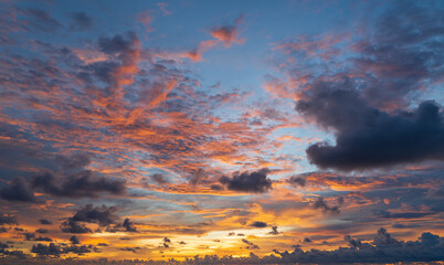 Wall Mural - abstract amazing scene of stuning colorful sunset with clouds background in nature and travel concep