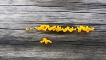 Yellow Fungus On Wooden Background