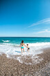 © zhukovvvlad - Mother and child go swimming in the sea