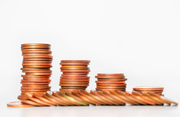 copper coin stack row growing pile on white background for money saving and investment business financial and banking concept.