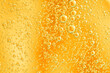 Yellow and orange bubbles, drops of oil in water, olive oil for cooking background. 