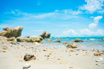 Landscape with white beach, the sea and the beautiful clouds in the blue sky