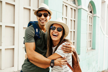 Happy tourist couple talking and having fun on the trip. Concept of travel and love in Latin America