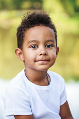 Wall Mural - Happy young beautiful african little boy