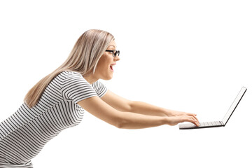 Sticker - Young woman running and typing on a floating laptop computer