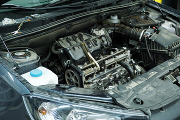 The engine of a modern car during repairs. 