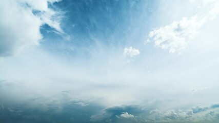 Wall Mural - Beautiful timelapse of white fluffy clouds moving softly across blue sky and changing gradually to dark heavy ones. The storm is coming.