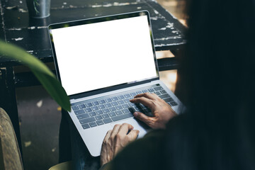 computer mockup blank screen.hand woman work using laptop with white background for advertising,contact business search information on desk at coffee shop.marketing and creative design