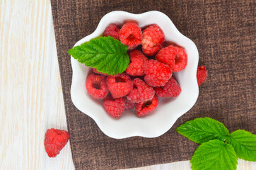 ripe and juicy raspberry berry. the concept of a summer crop, diet, vegetarian food.ecological products from the garden