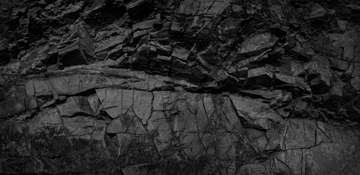 Wall Mural -  - Black and white background. Volumetric black stone background. 3d effect. Rock texture. Granite mountain texture. Close-up.