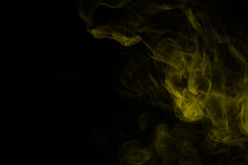 Yellow steam on a black background.