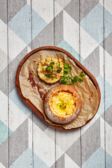 Canvas Print - Cheese soup served in round bread loaf