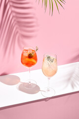 Aperol Spritz Cocktail on pink background