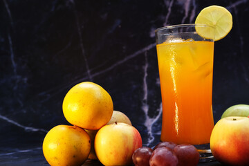 Sticker - chilled orange juice on table background, summer drinks