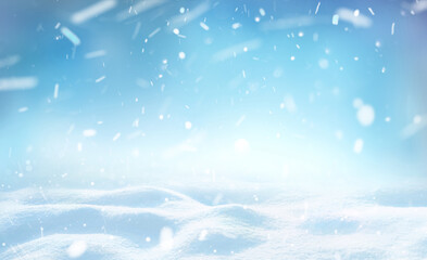 Wall Mural - Winter snow background with snowdrifts, beautiful light and falling flakes of snow on blue sky, drifting snow, copy space.