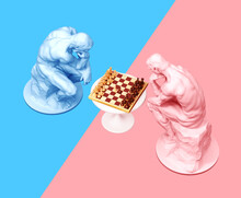 Two Thinkers Pondering The Chess Game On Blue And Pink Backgrounds