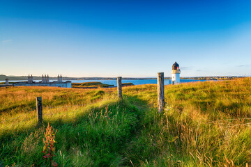 Wall Mural - The lighthouse and coastguard cottages at Arnish Point