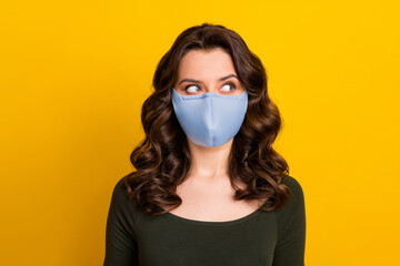 Poster - Close-up portrait of her she nice attractive minded wavy-haired girl wearing safety reusable textile mask medicine health care pandemia isolated bright vivid shine vibrant yellow color background