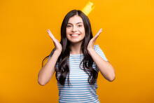 Brunette Woman In Paper Crown Smiling Isolated On Yellow