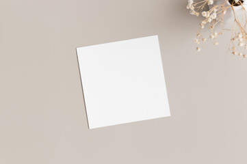 Square invitation card mockup with gypsophila.