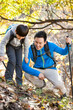 © Blue Jean Images - Cheerful father and son hiking in woods
