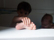 © Maria Manco/Stocksy - closeup of child's foot in bathtub