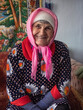 © Stas Pylypets/Stocksy - Portrait of a smiling happy old woman
