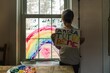 © Léa Jones/Stocksy - boy painting rainbow: Let's all be well