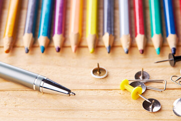 Wall Mural - office and school stationery supply over wooden desk. studio shot