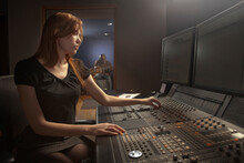 Caucasian Woman Working At Audio Control Panel