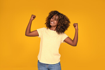 Wall Mural - African afro woman with curly hair smiling.