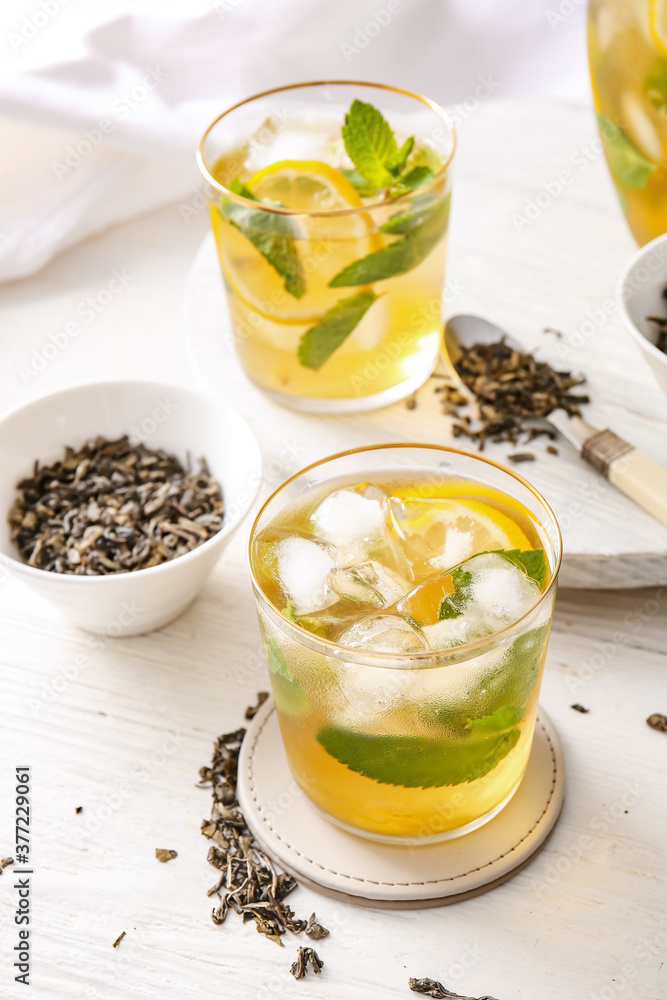 Glasses of tasty cold ice tea on table