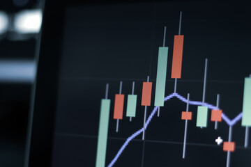 Stock exchange market trading at home. Work at home. Financial and economic concept. Stock market graph on laptop.