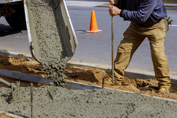 Canvas Print - Truck mixer pouring concrete cement for construction sidewalk