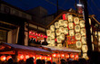 Night view of Yamahoko float with lanterns and people listening to music in Gion Festival in Kyoto, Japan