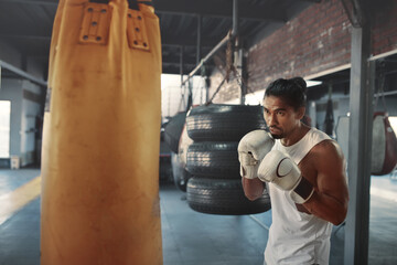 Wall Mural - Man Punching Bag. Asian Sportsman Boxing On Intense Workout. Training At Gym For Strong, Healthy, Muscular Body. Sexy Guy Using Sport Equipment.