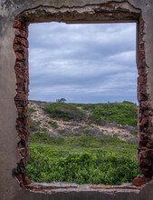 A Landscape Viewed Through The Window Of A Dilapidated Old Building Image In Vertical Format
