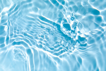 blurred transparent blue colored clear calm water surface texture with splashes and bubbles. trendy 