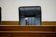 A courtroom in a Russian court, an empty judge's chair