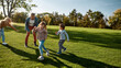 © Svitlana - Happy childhood memories. Excited family running outdoors on a sunny day