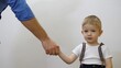 © MEDIAIMAG - Detail of father hand shake hand with blue eyes blond hair son, conceptual, generation deal