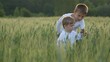 © MEDIAIMAG - Children play in green wheat field, brothers like agriculture