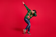 Full length body size view of his he nice attractive playful positive energetic youth guy having fun dancing moving dab clubbing isolated over bright vivid shine vibrant red color background