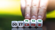 © Fokussiert - Hand turns dice and changes the expression 'do it later' to 'do it now'.