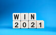© Aksana Kavaleuskaya - WIN 2021 years on wooden cubes on a blue background